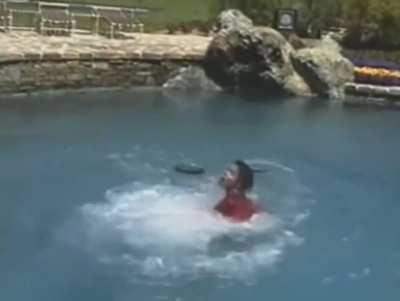 Macaulay Culkin pushes Michael Jackson off diving board, 1989