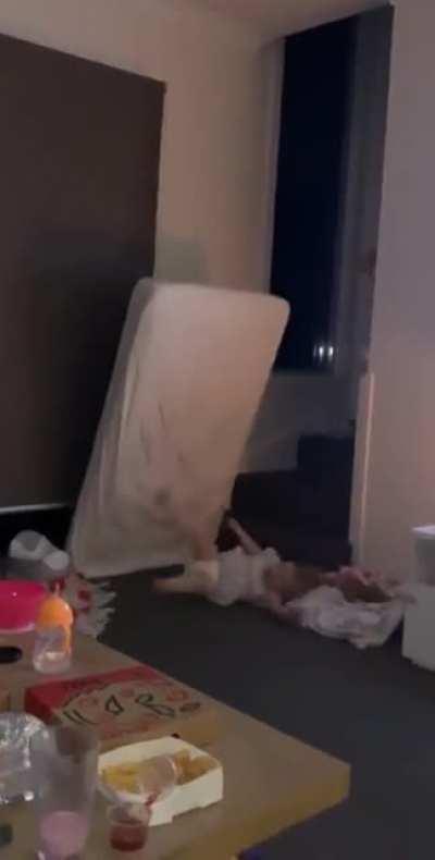 Kid runs into mattress............