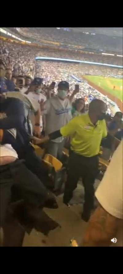 Dodger fans throwing stuff and assaulting Astro fans over a baseball game.