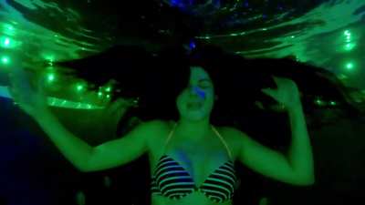 Nikkis ASMR talking in a multi-colored pool at night