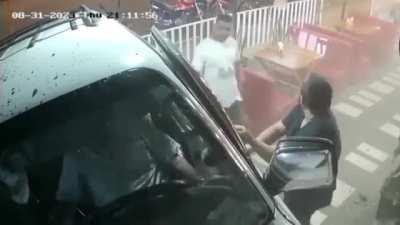 Car crashes through a business