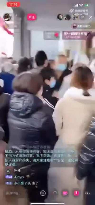 Protestors in Urumqi, China charge local police station to demand end to Covid Lockdown