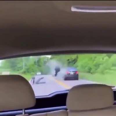 He decides to tilt his bike in the middle of the avenue