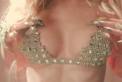 Dove Cameron groping her tits in her MV