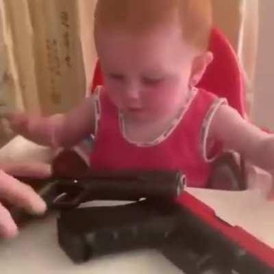 Giving a small infant firearms