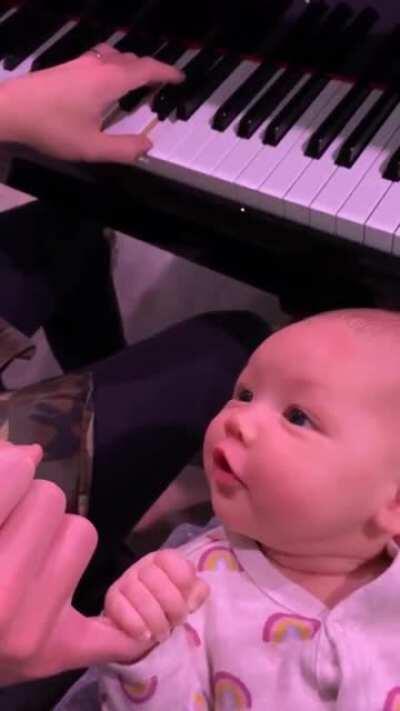 Listening to mom singing with holding mom's hand