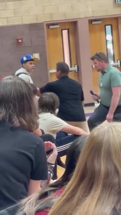 Kid attacks a teacher and gets put in a suplex by a police officer