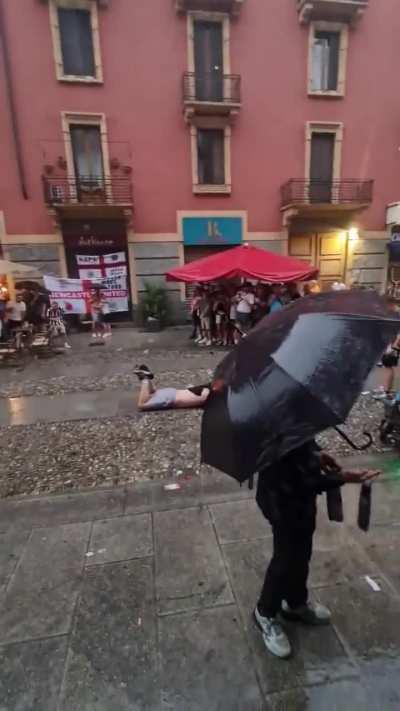 Newcastle fans making the most out of the rain in Milano