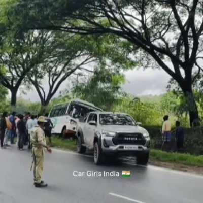 Toyota Hilux pulling a bus