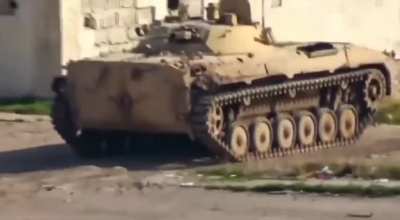 Cameraman is spotted by armored vehicle