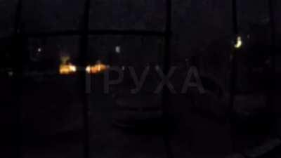 Ukrainian Video from front doorbell cam last night shows shelling that looks like a lightning storm until a neighbors car his struck with a round.