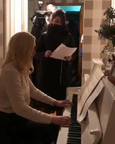 Head of the Navalny-linked Doctors' Alliance gives officials some Beethoven during a raid on her apartment of a criminal case on 'violation of sanitary and epidemiological rules'