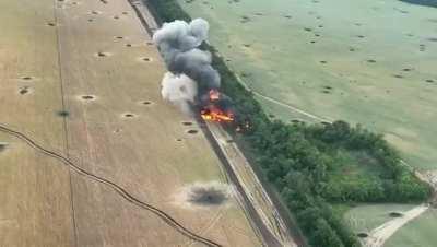 A Russian tank being blown up by Ukrainian forces