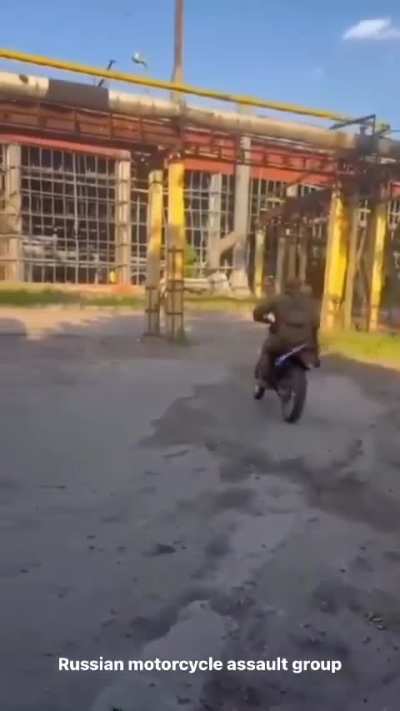 Russian soldier crashes a motorbike, knocking him out cold