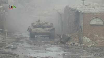 Syrian Army T-72s operating in Daraya engage the cameras position - 2/5/2013