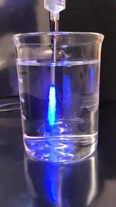 Luminol-based ECL reagent injected in a solution containing 10% bleach.