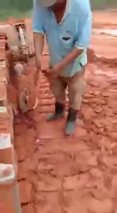 Guy catches snake, skins it alive and then proceeds to eat it. (NSFL)