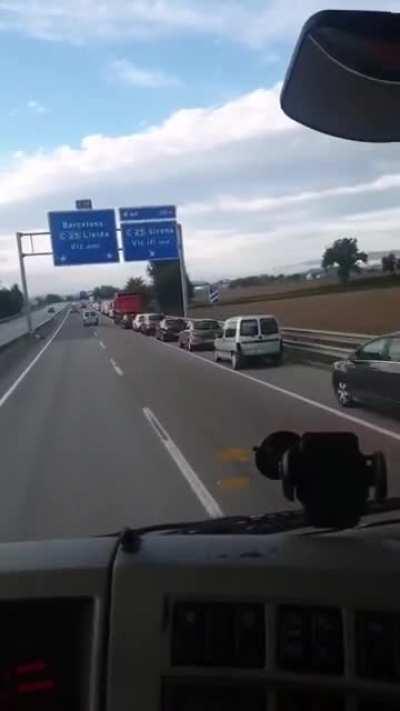 A bunch of idiots thought that the hard shoulder was the exit lane and started piling up behind a truck... who's telling them?
