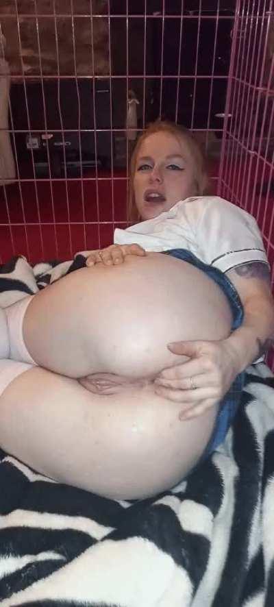 Back in my cage and teasing my ass.