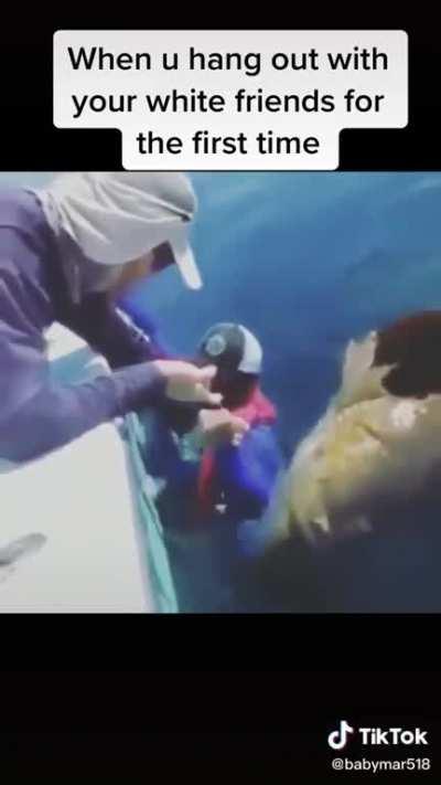 Black guy vs one really big ass fish