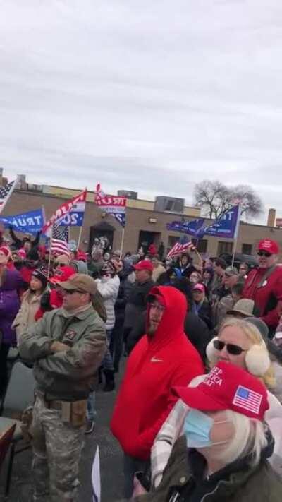 Crowd sings God Bless America after Milwaukee Health Department attempts to shut down rally.