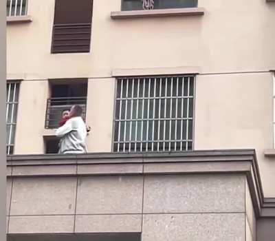 Hero passerby scales building in China to rescue boy who fell onto ledge
