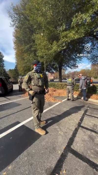 A group of ICE/CBP in American flag masks are going around and stopping people randomly in Charlotte, NC (11/16/25)