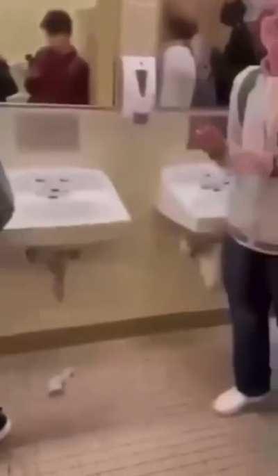 Bullies at a high school push a student with Down syndrome