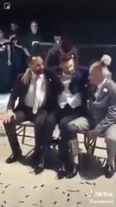 Groomsmen help wheelchair-bound groom have his first dance with bride in heart-warming video