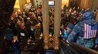 State Police prevent armed protestors from getting to Michigan's governor at the state house