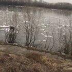Three kids floating down the river on ice