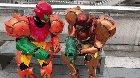 Samus cosplayers comparing blasters
