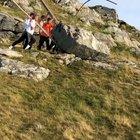 Pushing a boulder off a Norway hillside
