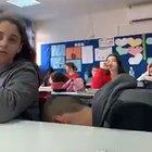 Kid received permission from the teacher to eat a fruit during class.