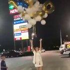 Girl releases graduation balloons and hit power lines taking out power in whole neighborhood