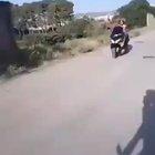 Motorcyclist doing a stunt meets a pole