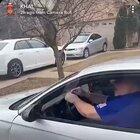 Two men argue, one shatters window