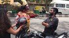 Guy dressed up as Yama (God of death), stopping all the bikers who were not wearing helmets and giving them one for free.