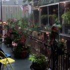 Watching the rain and listening to jazz on a balcony in new orleans
