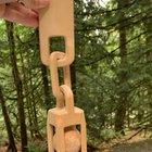 This was made from a single piece of wood. The balls were chiseled out from within the solid block