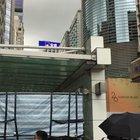 Protesters encouraging man not to jump off the building