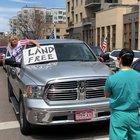A nurse in Colorado silently counterprotesting and enduring racist abuse.