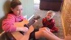 Girl sings to her 2 year-old brother with down syndrome as a method of speech therapy. Every word he has learned has been through music therapy.