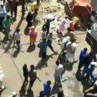 Group of people throwing stones at the doctors who came to test an expected COVID-19 patient in Indore, India.