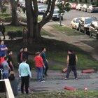 Trashy guys fight and try to jump the guy in black, the lady in red sweater is a bad ass